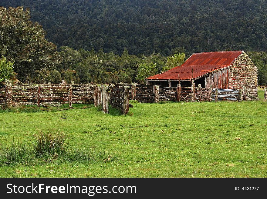 Rustic timber farm building and fences located along New Zealand's South-west coast. Rustic timber farm building and fences located along New Zealand's South-west coast