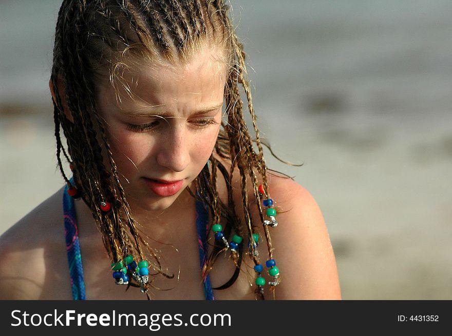 Young Girl On Beach With Braids