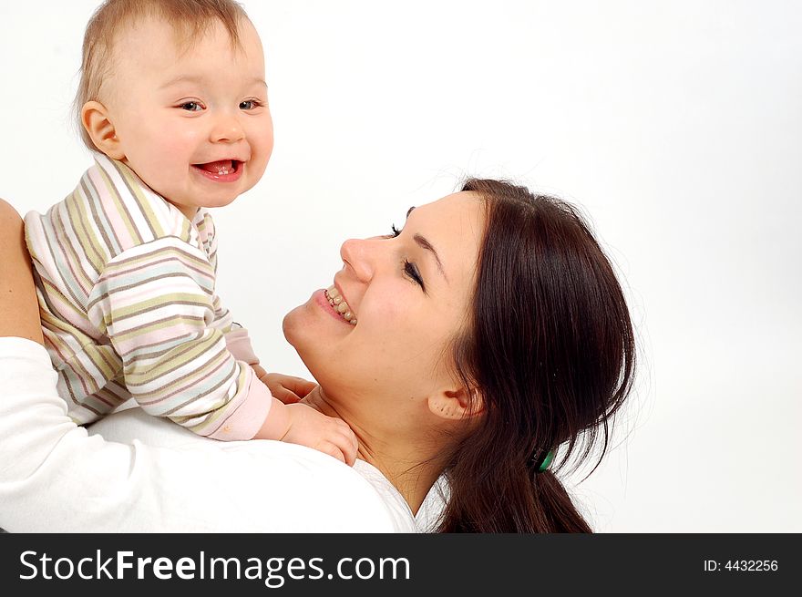 Happy mother and baby girl on white background