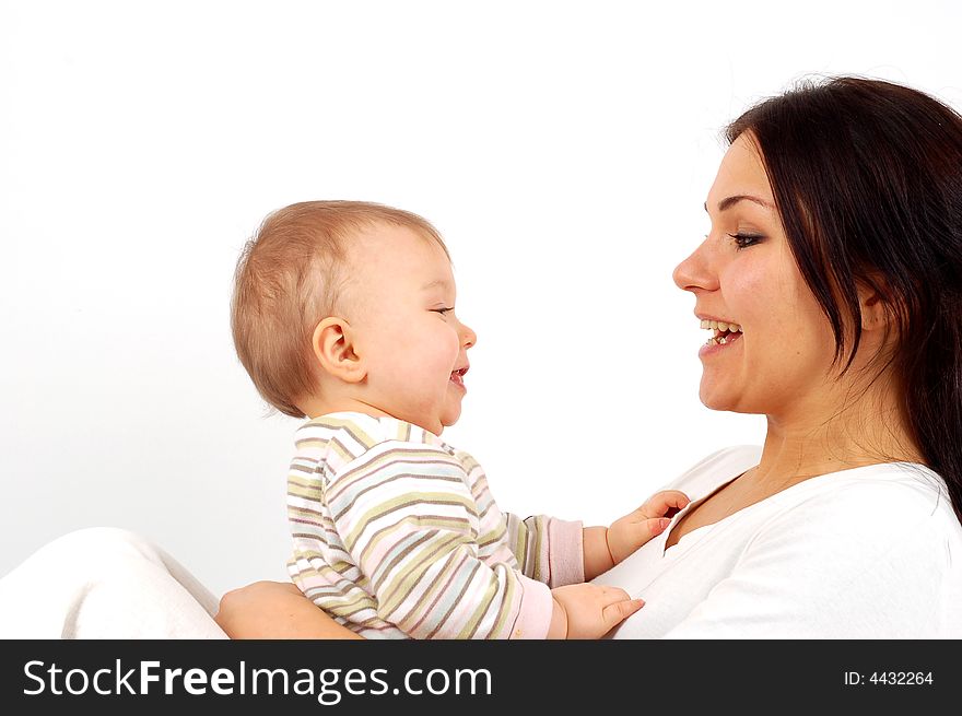 Happy mother and baby girl on white background