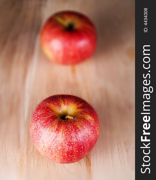 Two red apples in a kitchen
