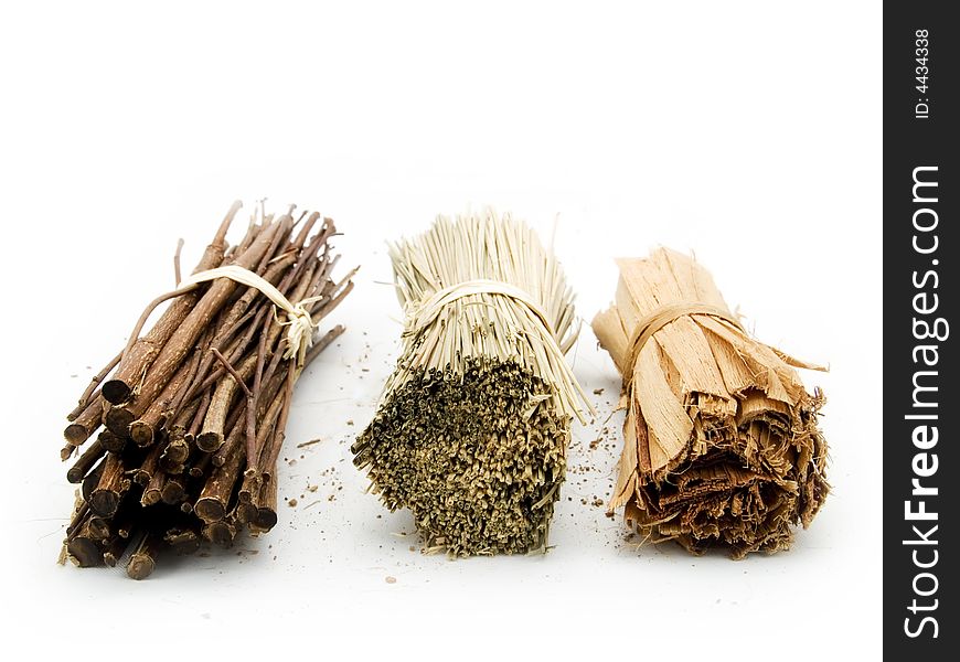 Twig and herbs on a white background