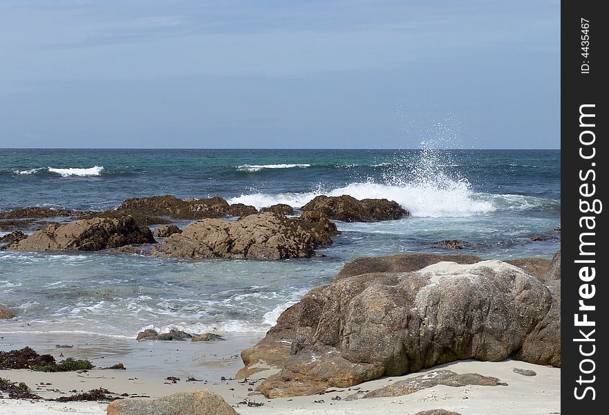 Waves and boulders at California beach