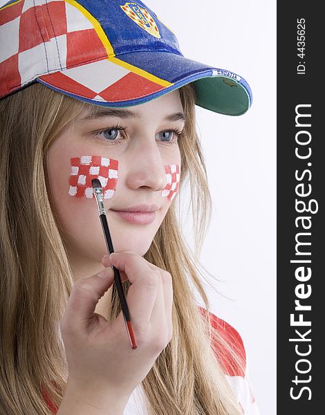 Croatia fan with face painting of the national flag