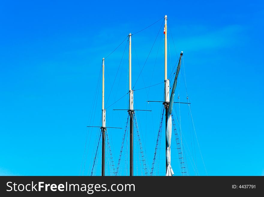 Masts of a sailing ship at the sea on a beautiful day