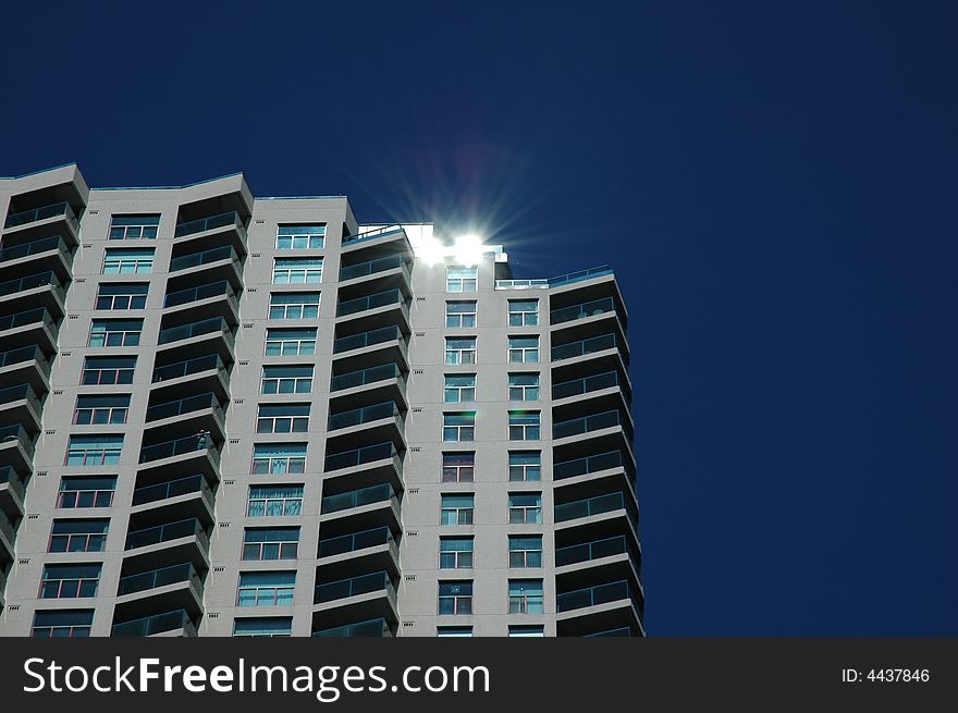 Reflection of the sun off a building on a beautiful day