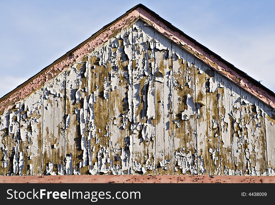 Peeling paint on old weather beaten shed