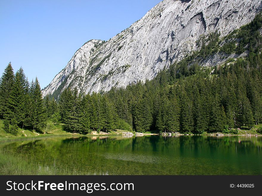 View of a lake in the french alps. View of a lake in the french alps