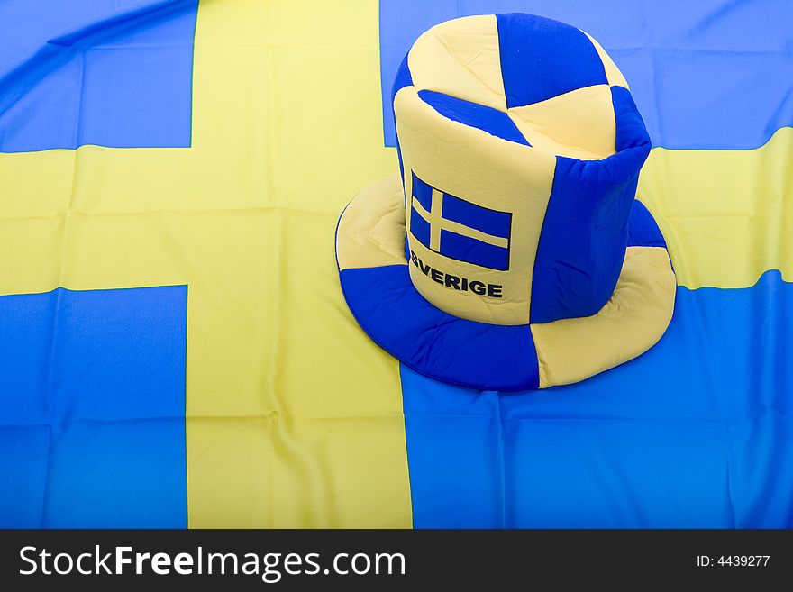 Swedish national flag with a hat as Memorabilia. Swedish national flag with a hat as Memorabilia