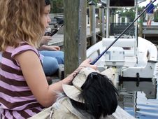 Little Girl Fishing With Dog Royalty Free Stock Photo