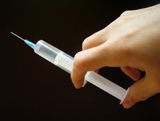 Hand With Syringe... Royalty Free Stock Photos