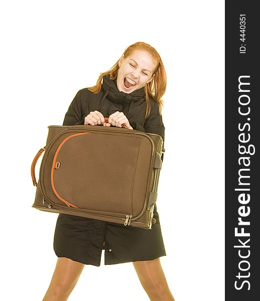 Happy young woman with a suitcase in her hand. Happy young woman with a suitcase in her hand