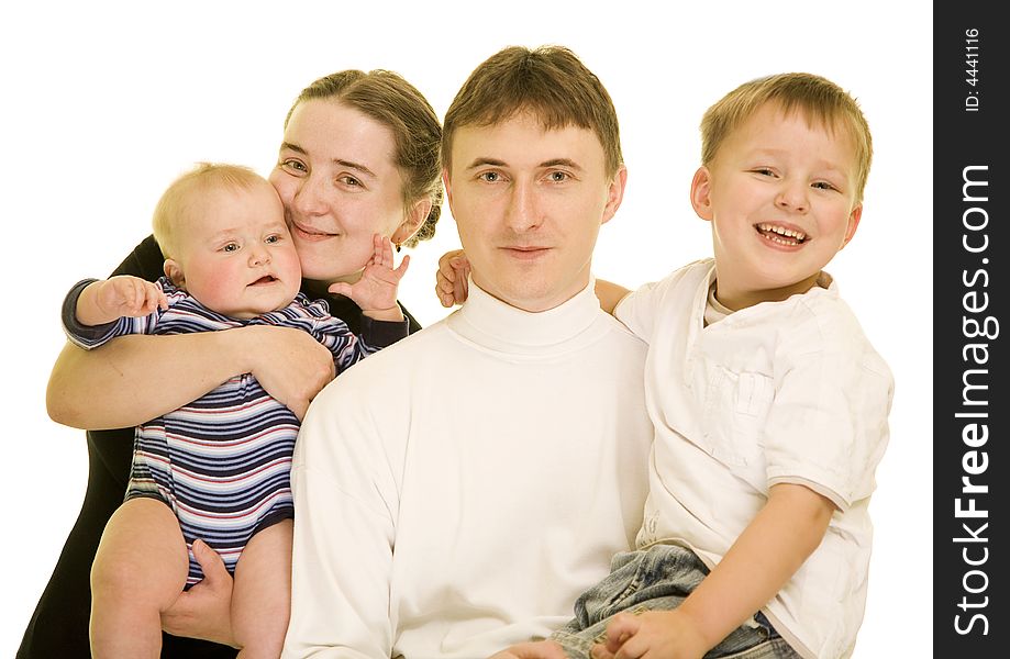 Attractive young family laughing while posing together for a portrait; copy space can be expanded