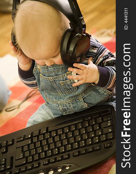 Young boy with keyboard an headphones. Young boy with keyboard an headphones