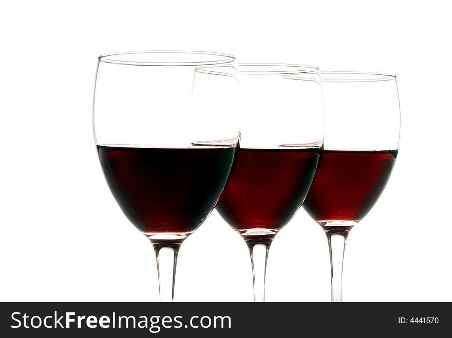Three glasses of red wine isolated on a white background. Three glasses of red wine isolated on a white background