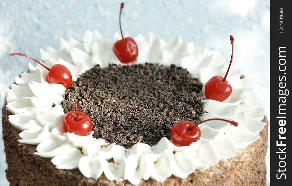 Festive cake with chocolate chip and cherry