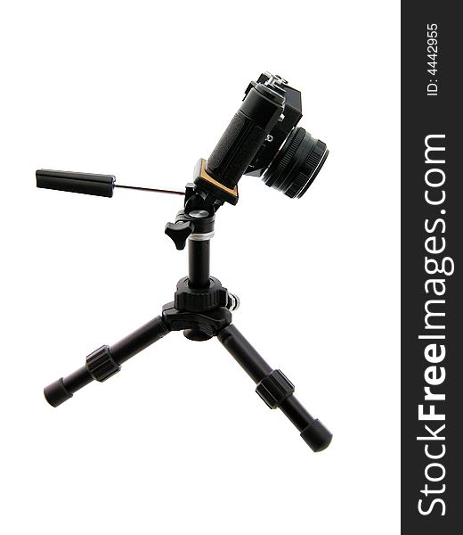 Photographing. Black tripod and camera isolated on white. Photographing. Black tripod and camera isolated on white