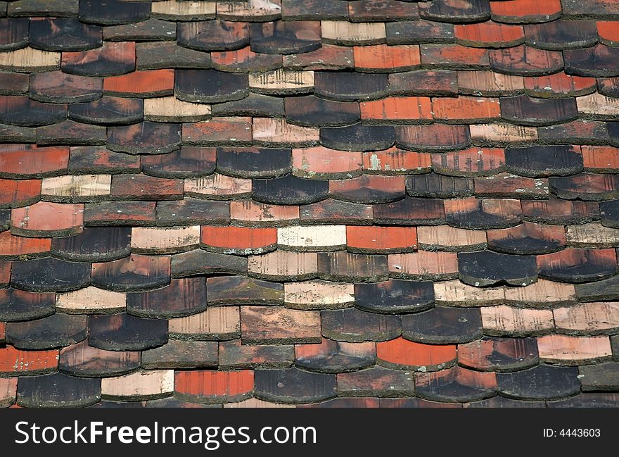 Old tiles on a roof. Old tiles on a roof