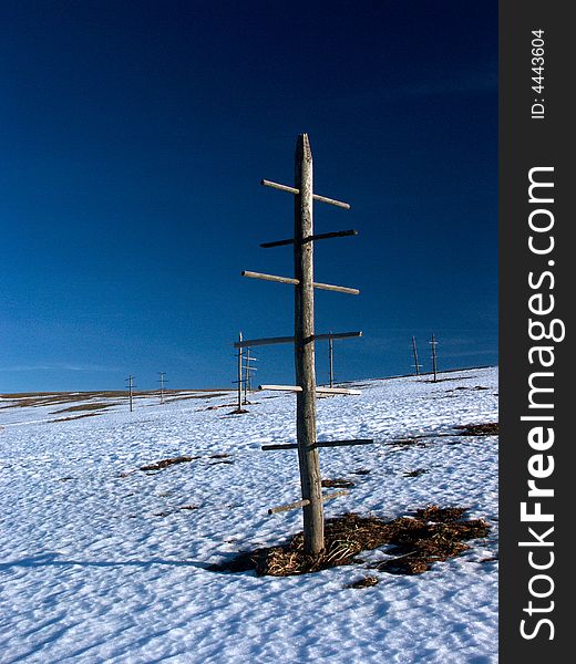 Wooden  hay drying racks in snow