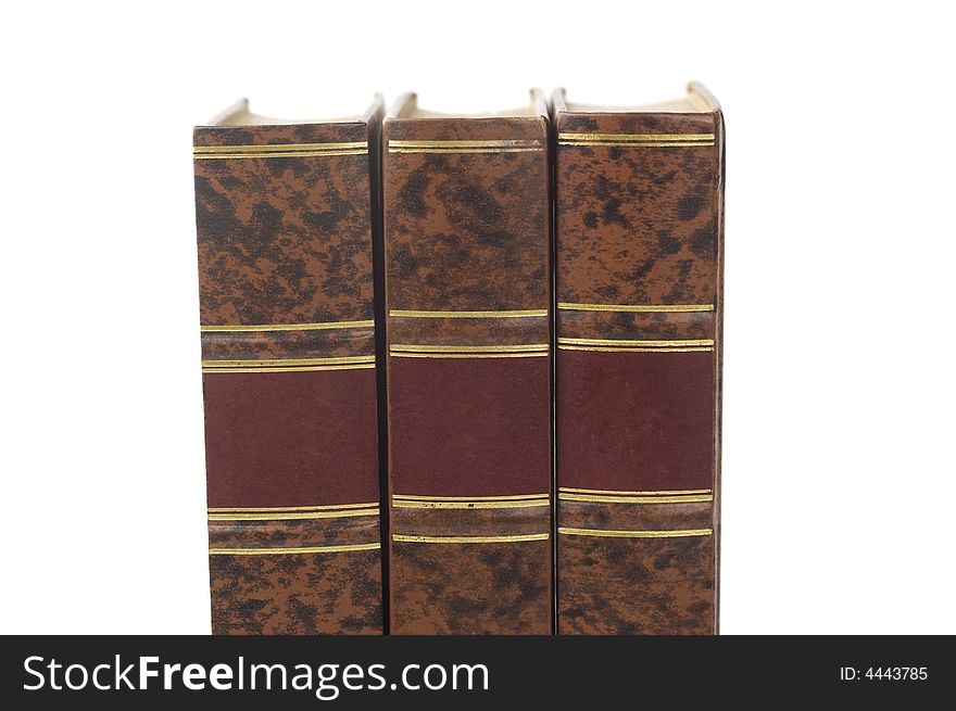 Row of three old books isolated on white background