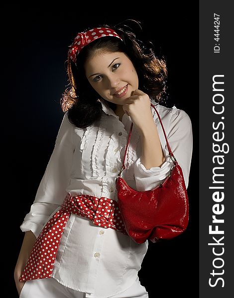 Attractive young girl with red handbag