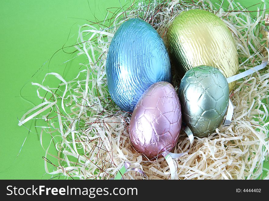 Assortment of chocolate Easter eggs wrapped in colorful paper. Assortment of chocolate Easter eggs wrapped in colorful paper