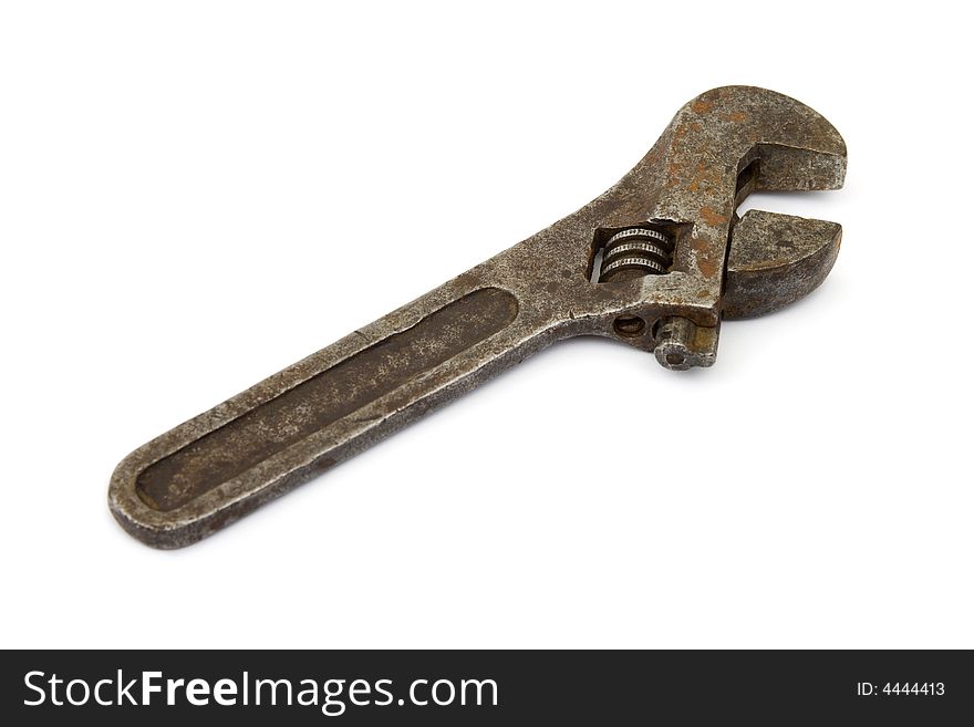 Old adjustable spanner, isolated on white background