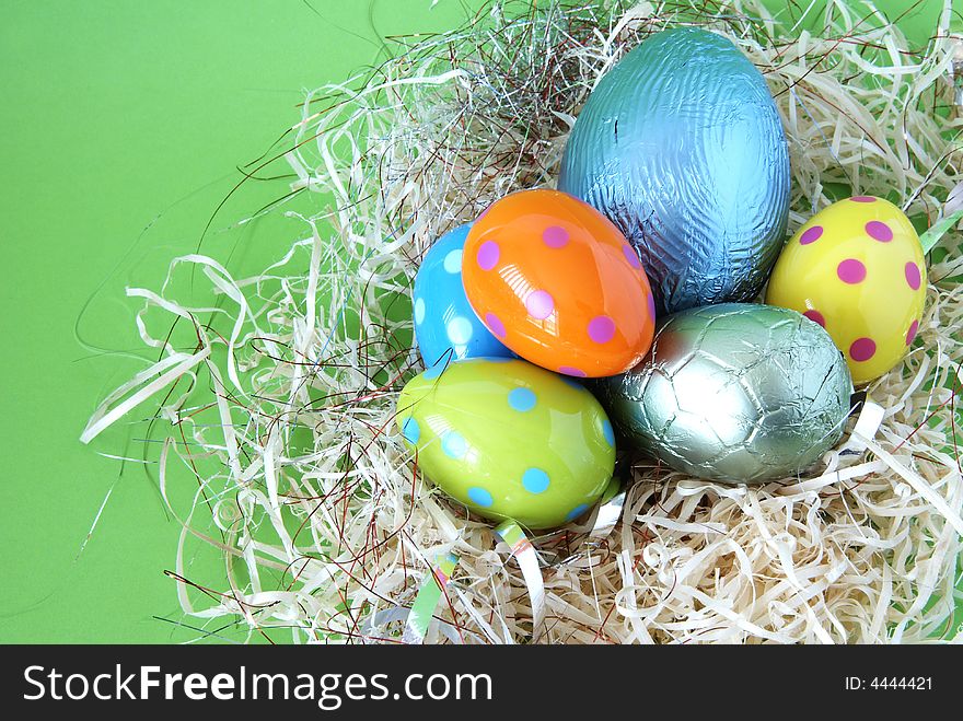 Assortment of chocolate Easter eggs wrapped in colorful paper. Assortment of chocolate Easter eggs wrapped in colorful paper