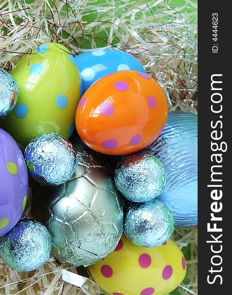 Assortment of chocolate Easter eggs wrapped in colorful paper. Assortment of chocolate Easter eggs wrapped in colorful paper