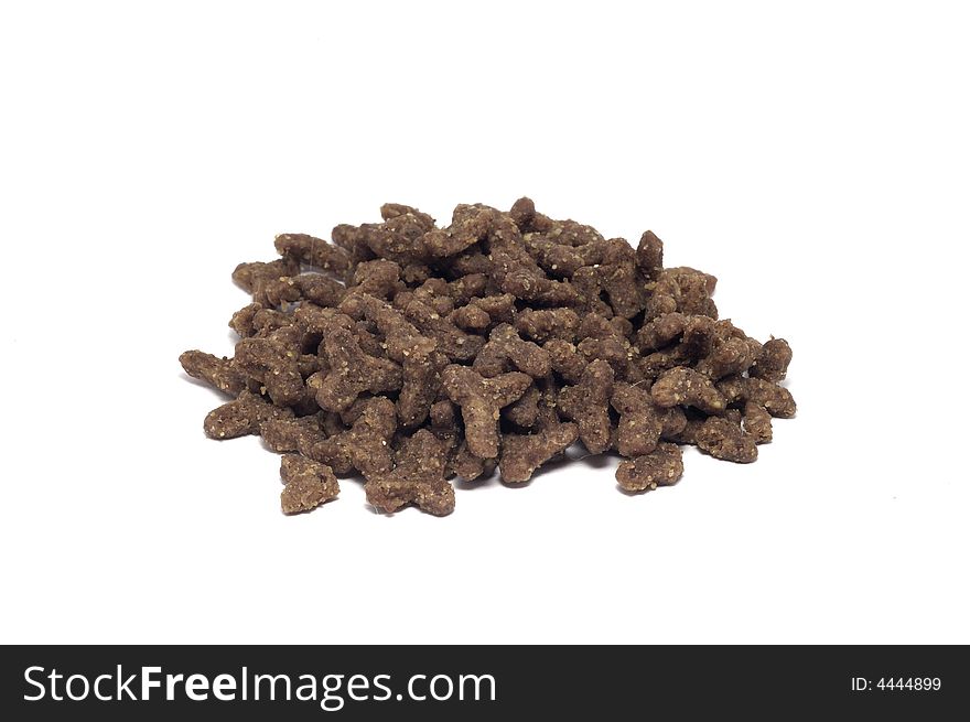 A pile of dry cat food isolated on white.