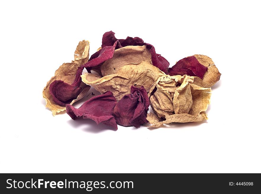 A pile of dried rose petals isolated on white.