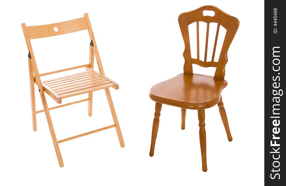 Two wooden chairs isolated on a white background
