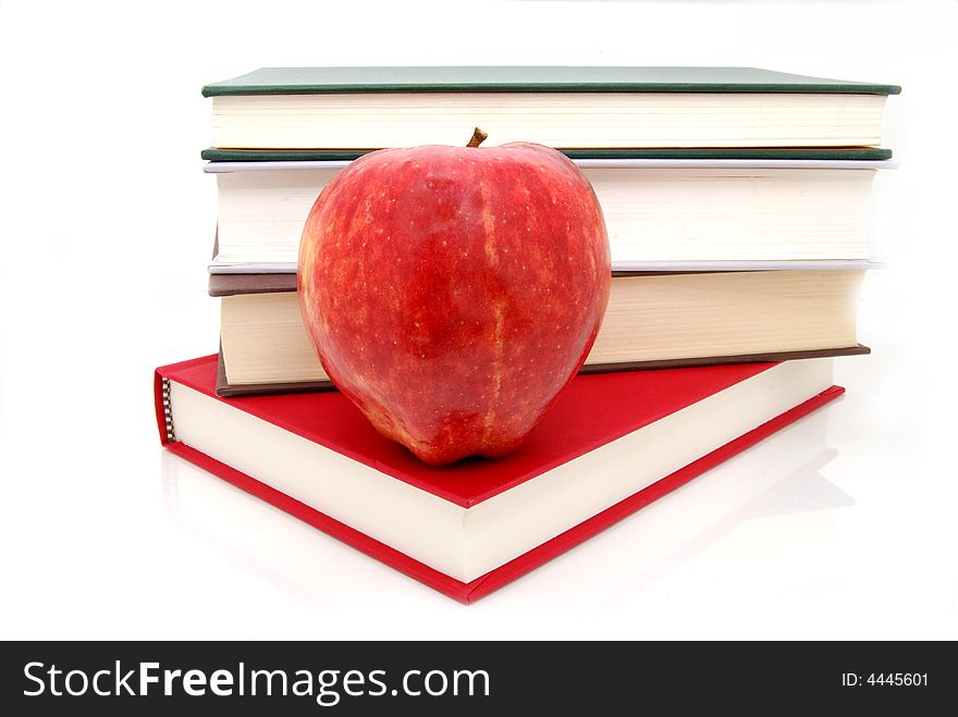 Apple with a stack of books. Apple with a stack of books