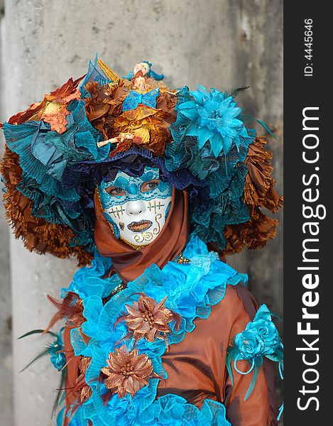 Woman wearing a beautiful costume and painted mask. Woman wearing a beautiful costume and painted mask.