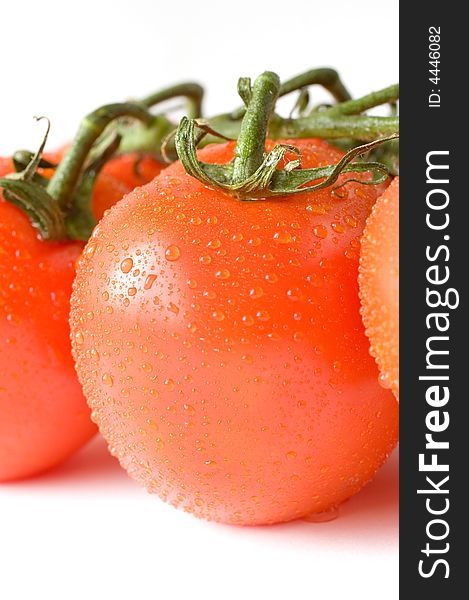 A Branch Of Fresh Red Tomatoes On White Background