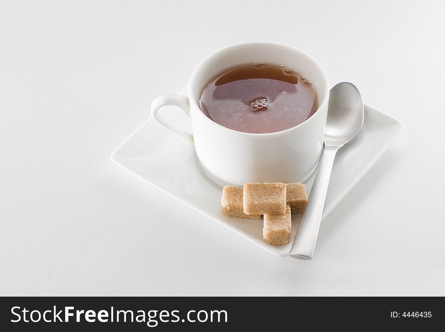 A cup of fleshly brewed tea isolated on white background. A cup of fleshly brewed tea isolated on white background.