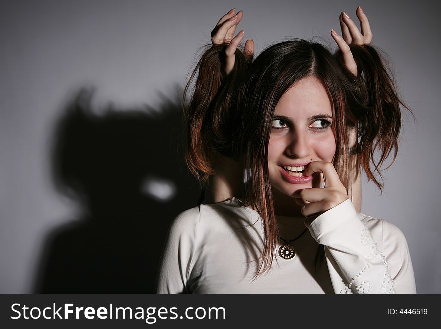 Photo of a young girl with demonic smile. Photo of a young girl with demonic smile