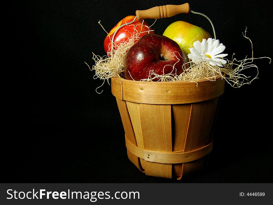 Basket of apples on a black background. Basket of apples on a black background.