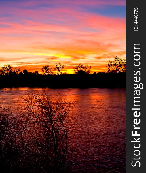 Colorful sky reflection in the river at sunset. Colorful sky reflection in the river at sunset