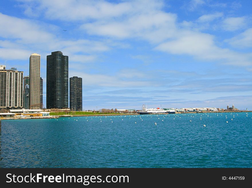 Chicago lakeshore from Lake Michigan vantage with buildings in background.