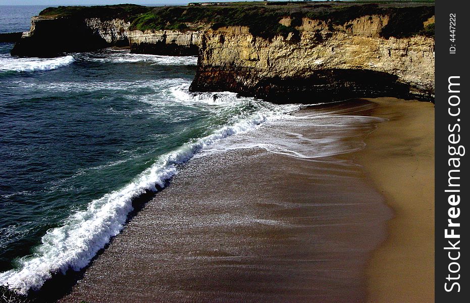 Taken just north of Santa Cruz, this tiny beach is perfectly hidden among the cliffs. Taken just north of Santa Cruz, this tiny beach is perfectly hidden among the cliffs.