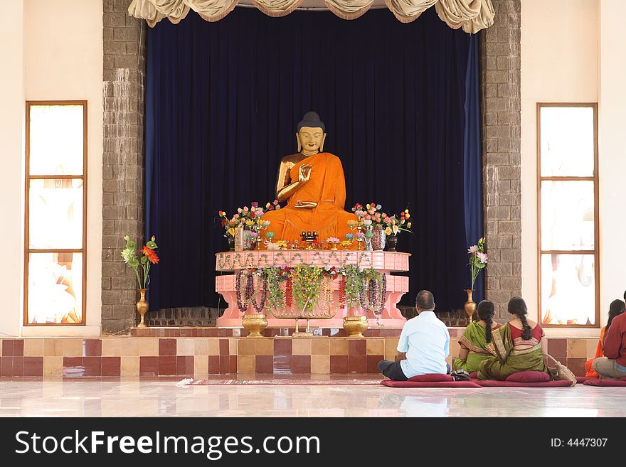 Golden budda with saffron cloth. Golden budda with saffron cloth