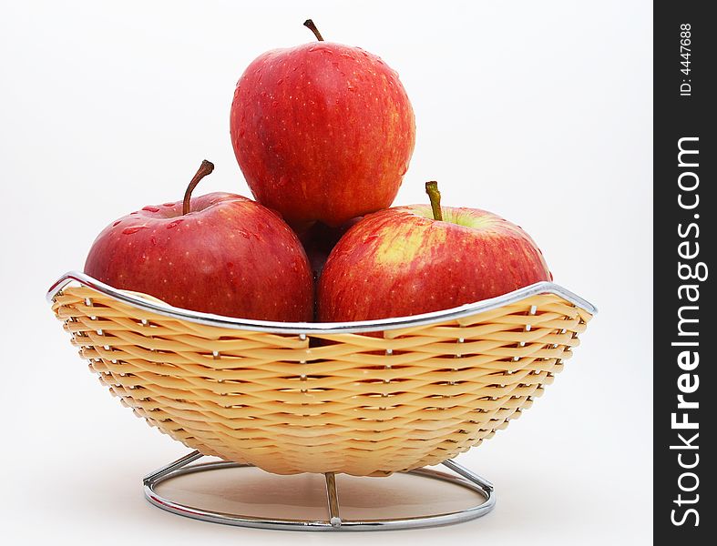 Fresh red apples with water drops on them