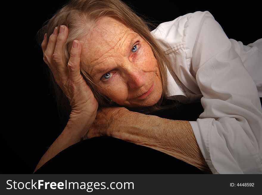 Image of a beautiful woman Reclining on Black. Image of a beautiful woman Reclining on Black