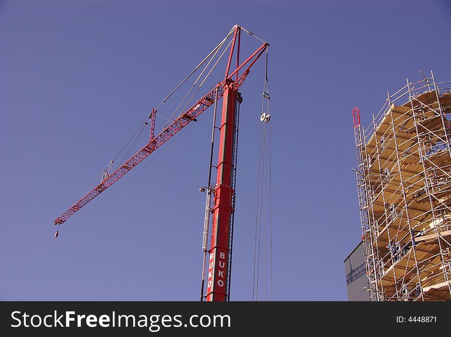 A crane in front of the Corpus building in Leiden, the Netherlands, under construction. A crane in front of the Corpus building in Leiden, the Netherlands, under construction