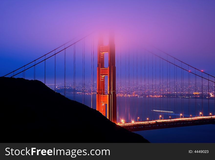 Golden Gate Bridge at night during fog