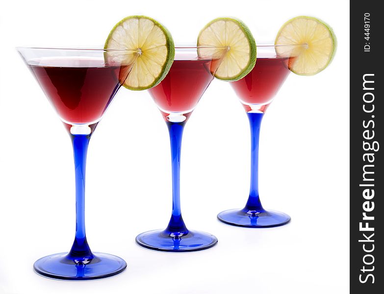 Red cocktails with lime over white