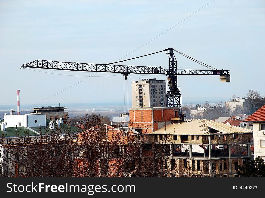 Workers On A Roof Waiting