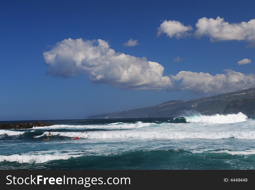 Sea shore with waves and nice clouds above. Sea shore with waves and nice clouds above