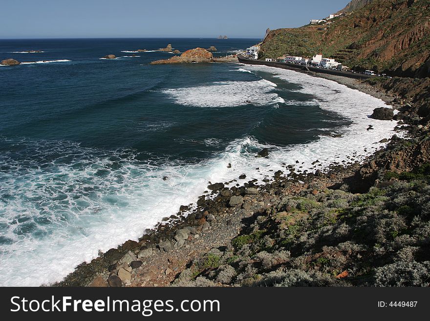 Stone coast with white waves. Canary Islands. Stone coast with white waves. Canary Islands